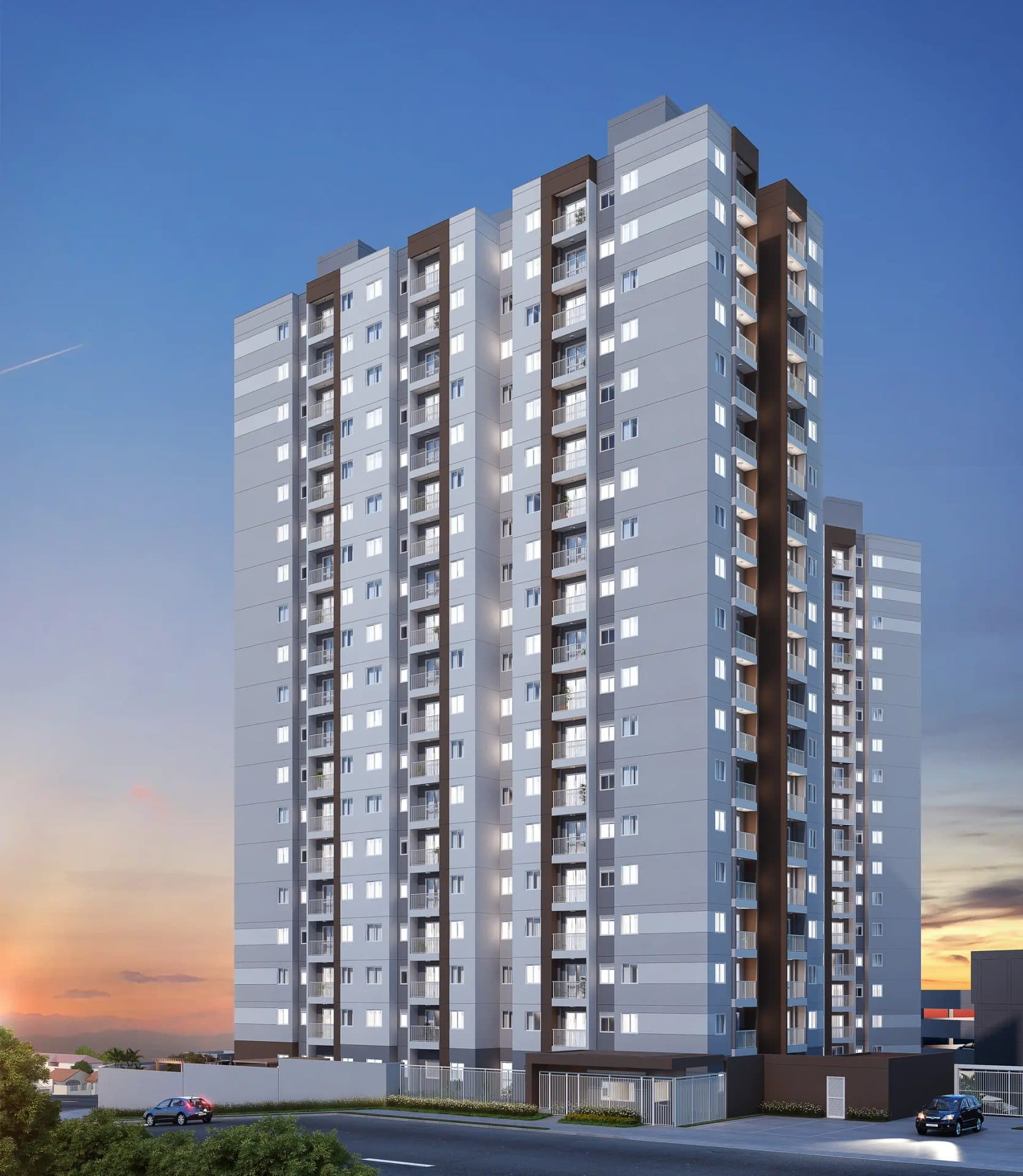 Fachada do edifício residencial de múltiplos andares com varandas e pintura em tons de cinza e marrom.