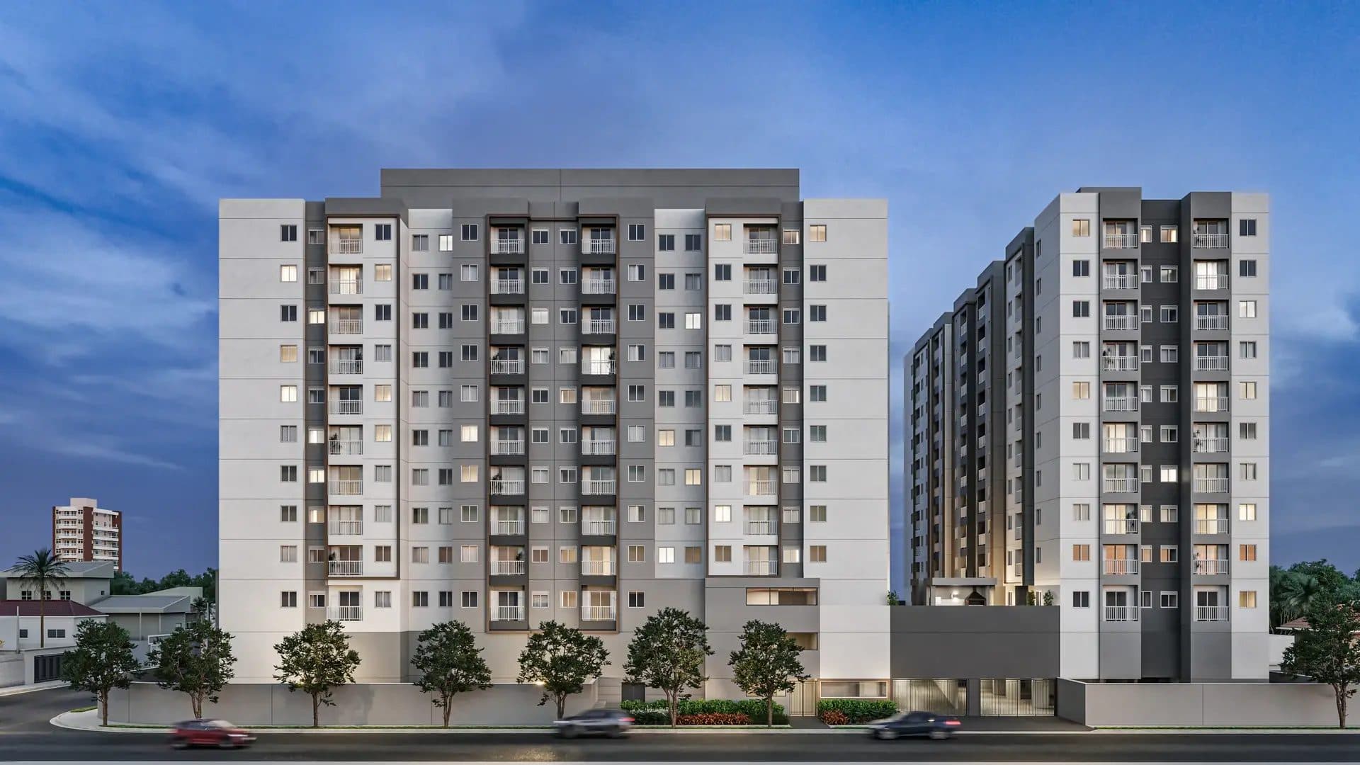Fachada frontal de complexo residencial com múltiplos pavimentos e varandas.